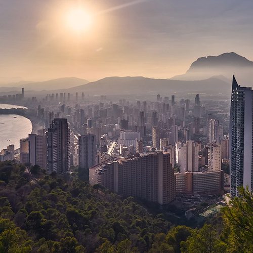View over Benidorm’s skyline and coastline from a high viewpoint at sunset