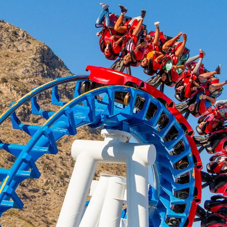 Visitors enjoying a roller coaster at a Benidorm theme park