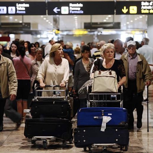 Passengers leaving the airport arrivals hall